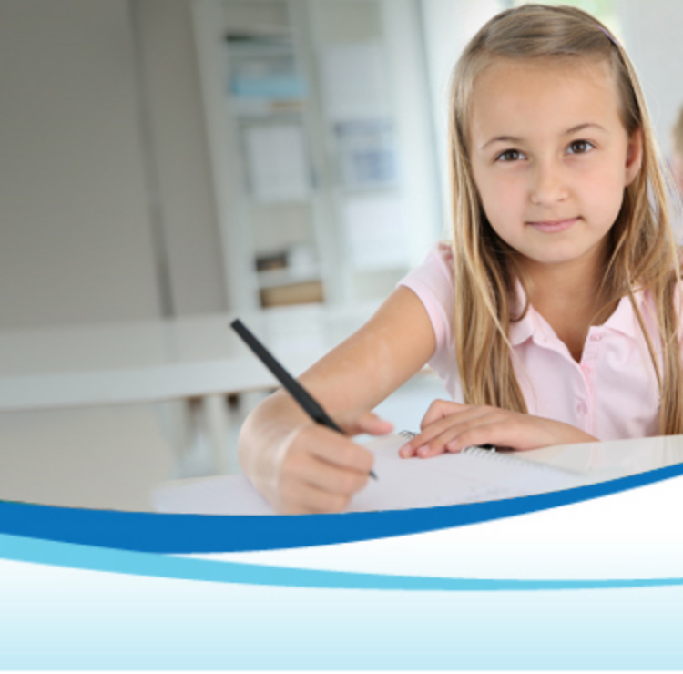 little girl writing on notebook