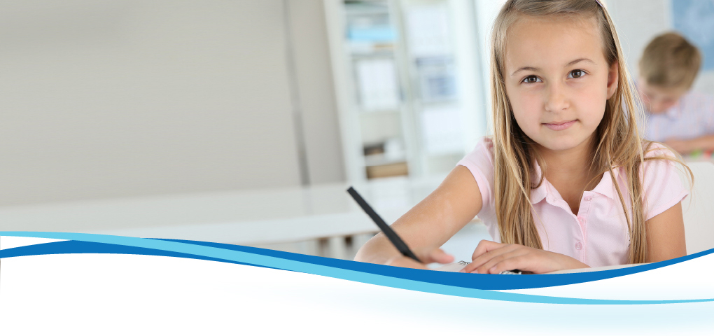 little girl writing on notebook